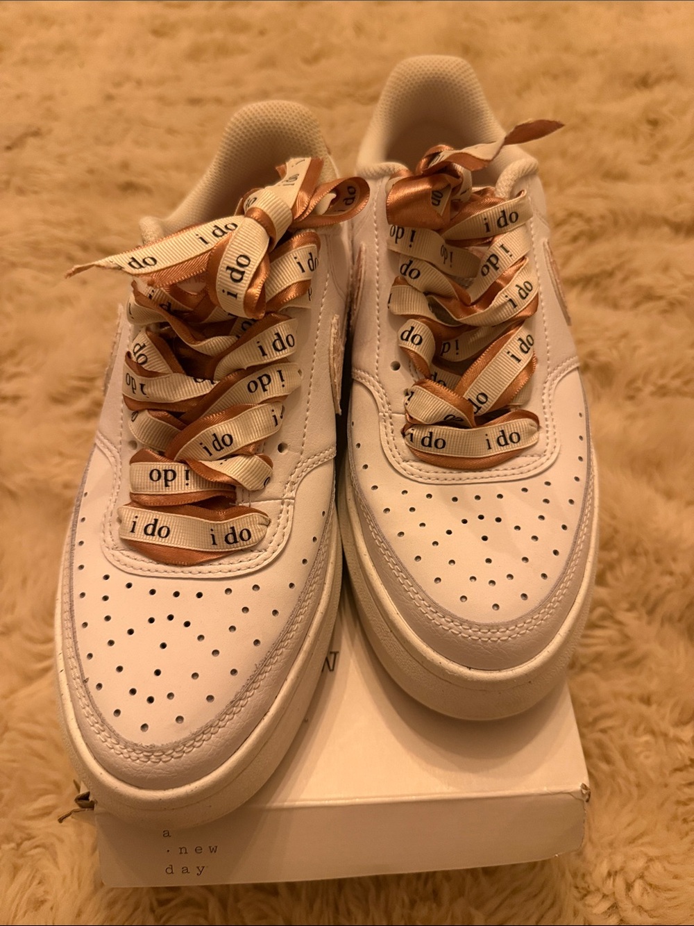 Nike White Sneakers with Rose Gold Accents and Ribbon Laces
